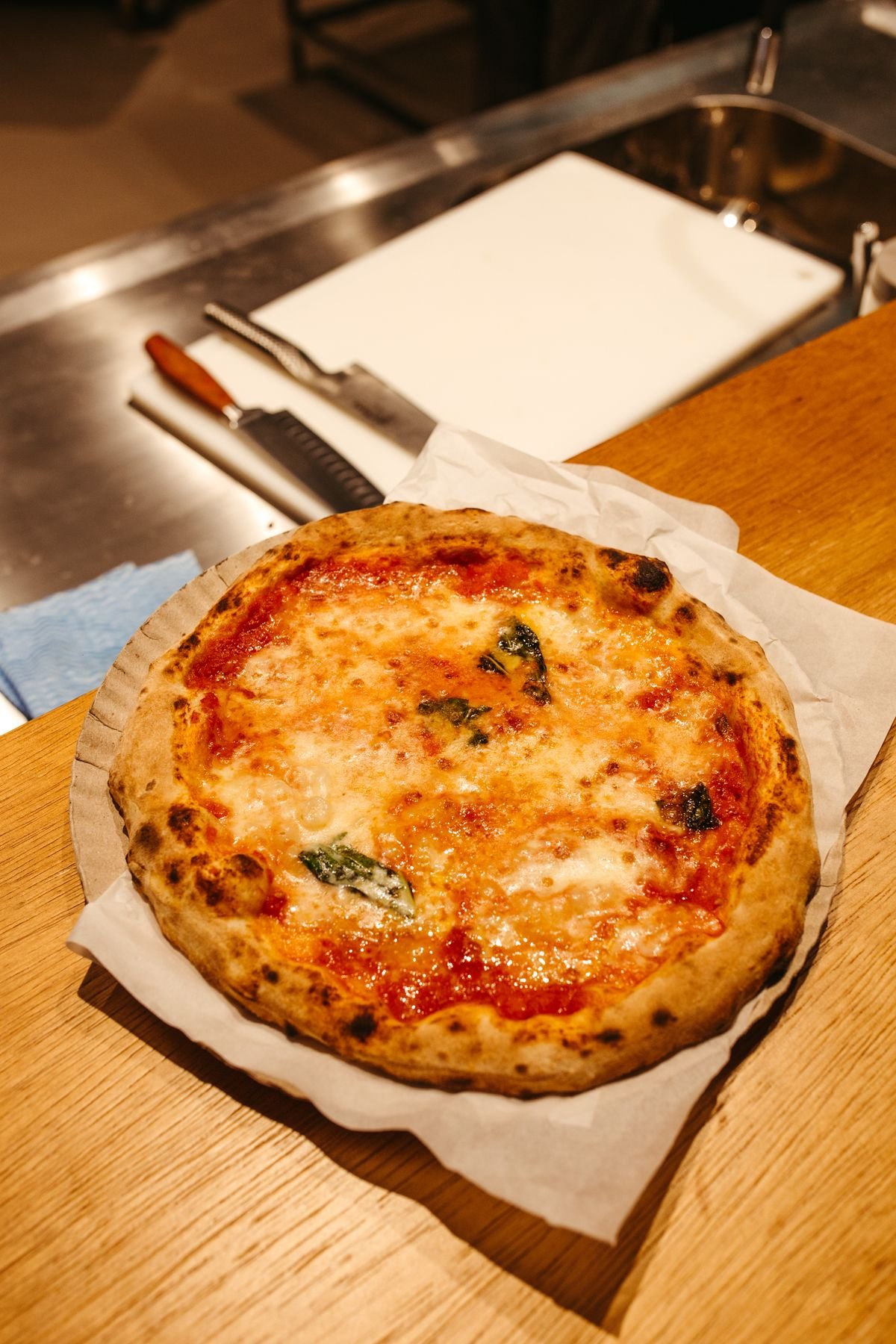 Wood-fired tomato and basil pizza